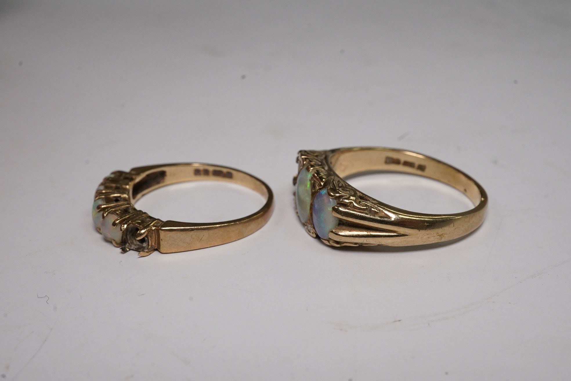 Two 9ct gold and opal cluster set rings, stones missing, gross weight 6.7 grams, Condition - poor